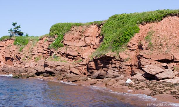 Sea glass collecting along the red sandstone cliffs found all along Prince Edward Island.